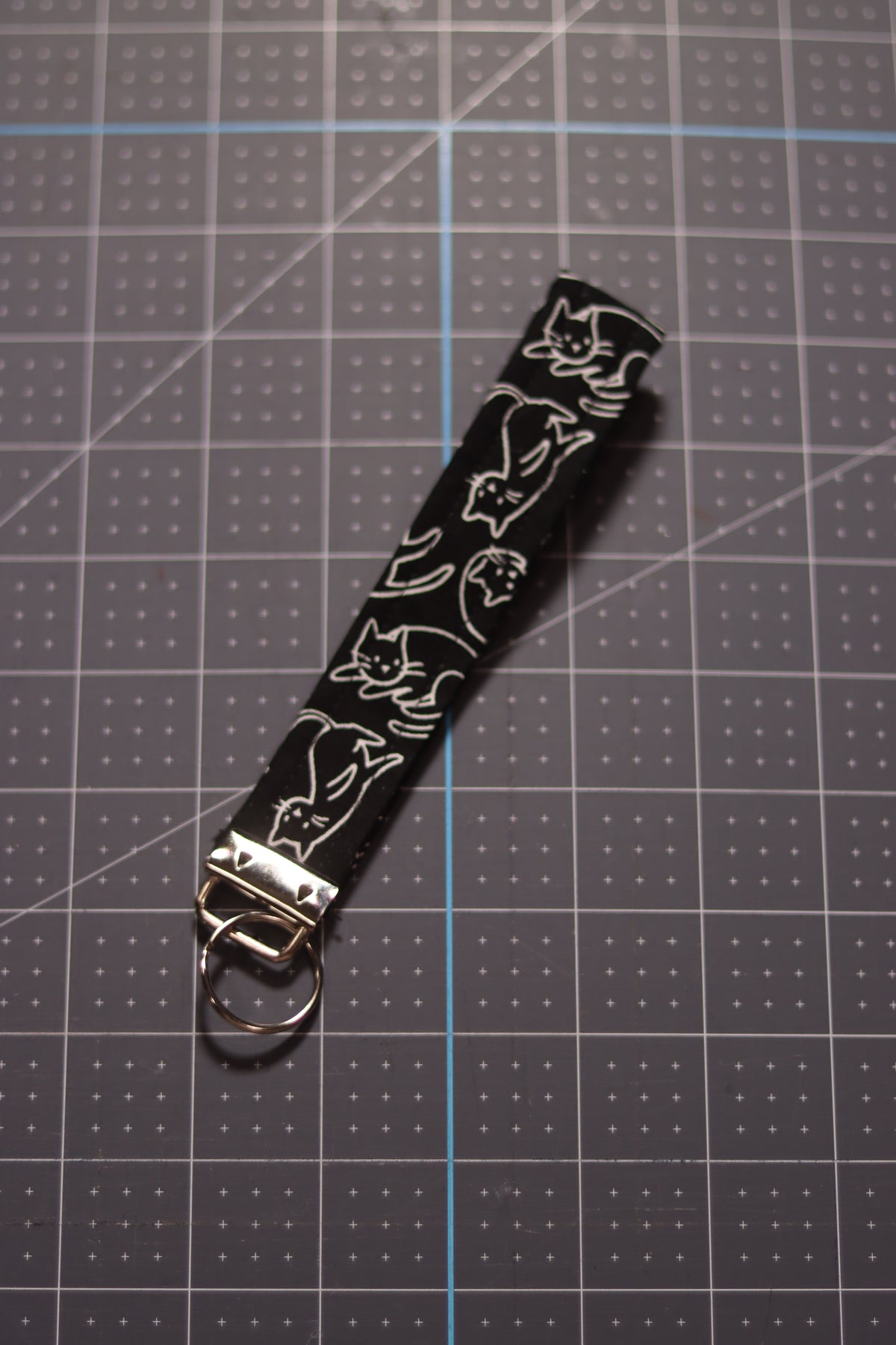 White Cats Outline on Black Wristlet