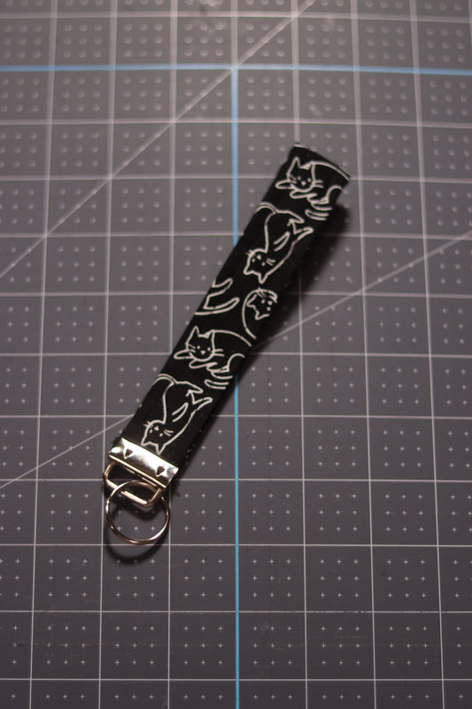 White Cats Outline on Black Wristlet